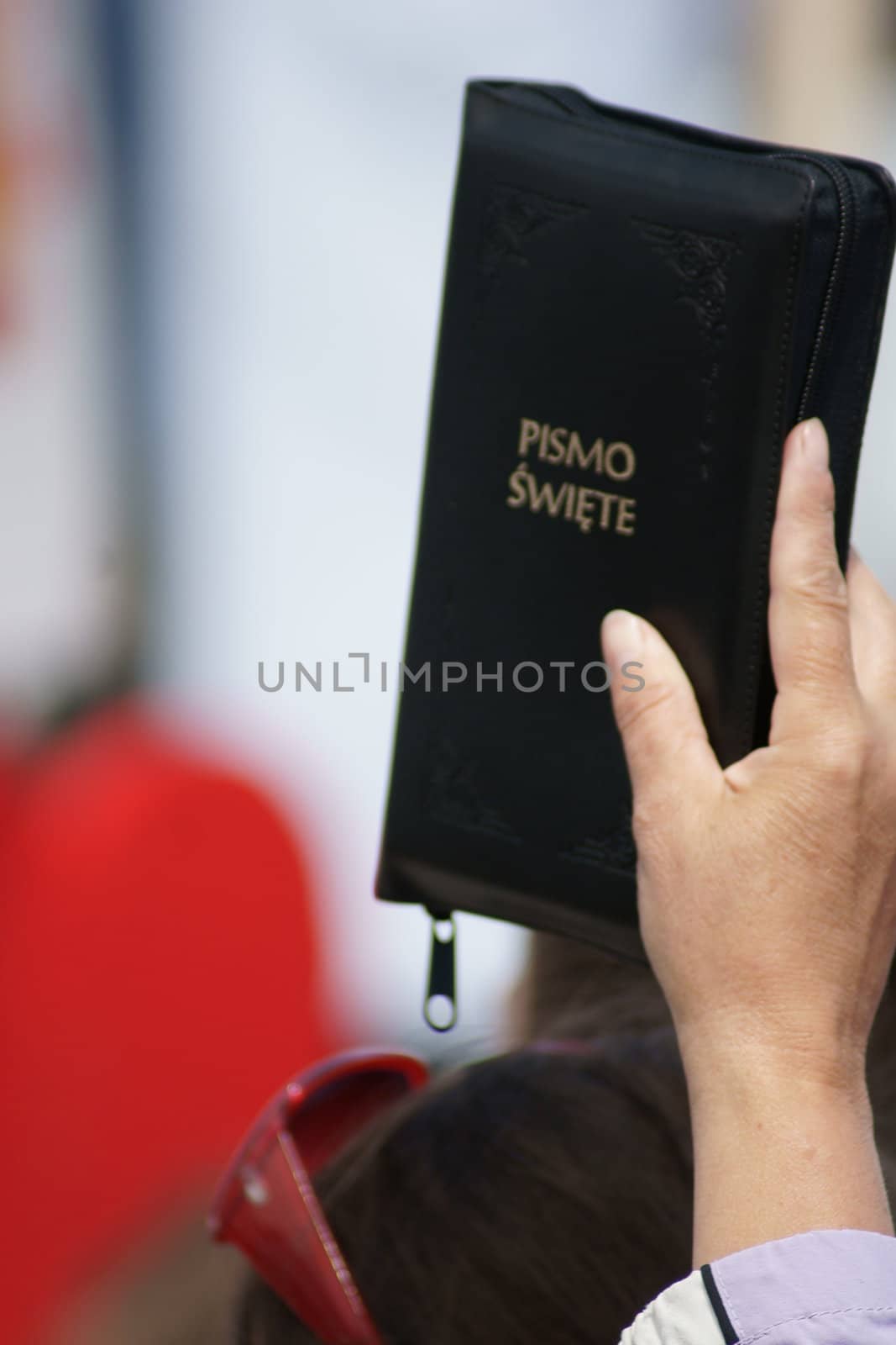 Warszaw, Poland - June 06: Woman who have a Sacred Scripture in Pilsudzkiego square on the Cross devotion Pope John  Paul II in the 20th anniversary of the Polish pope. About the pilgrimage: "Let your spirit come down and renew the  face of the earth"