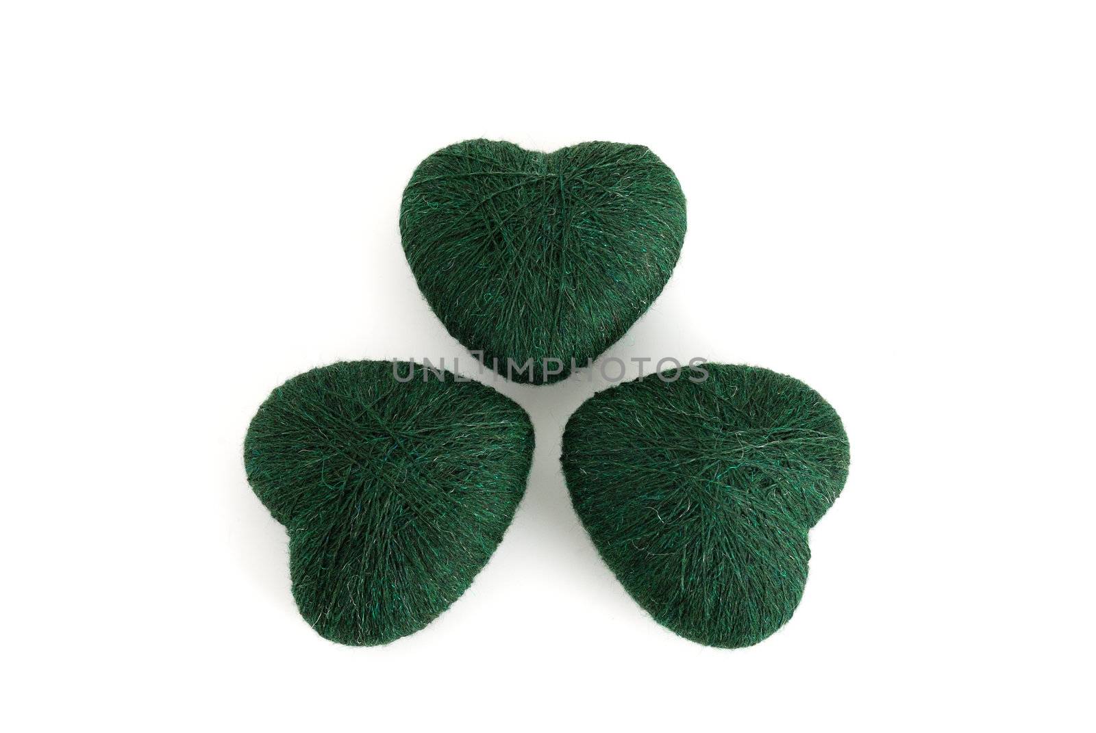 3-leaf clover (shamrock) formed out of green  heart shaped clews on white background