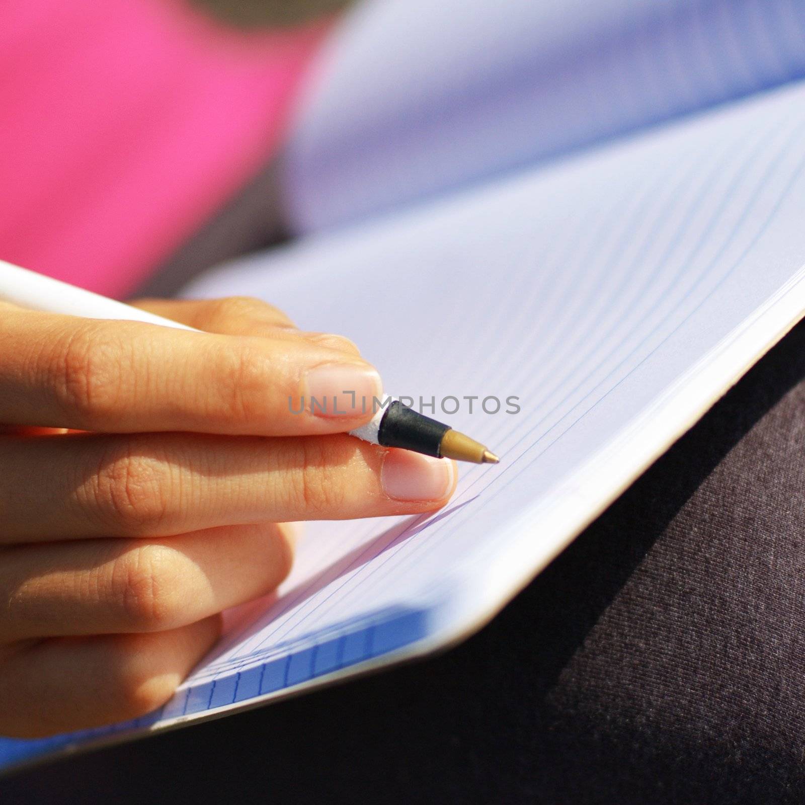 Girl Writing in Note Book by cardmaverick