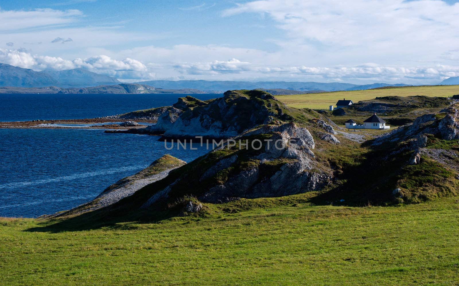 White houses on the coast of small bay, Trollholmsund, Finnmark, Norway