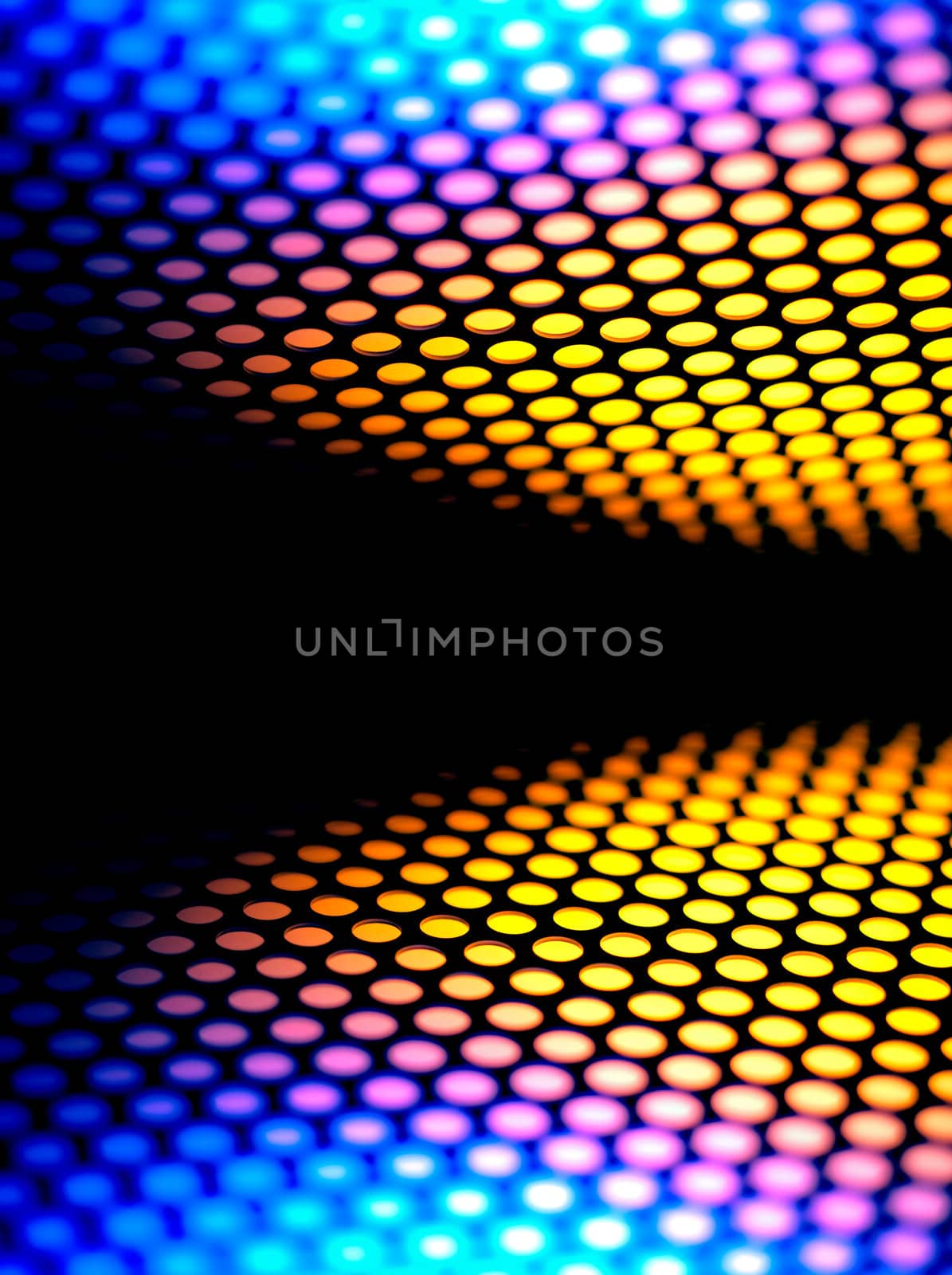 A metalic reflective surface back lit by a colorful light.