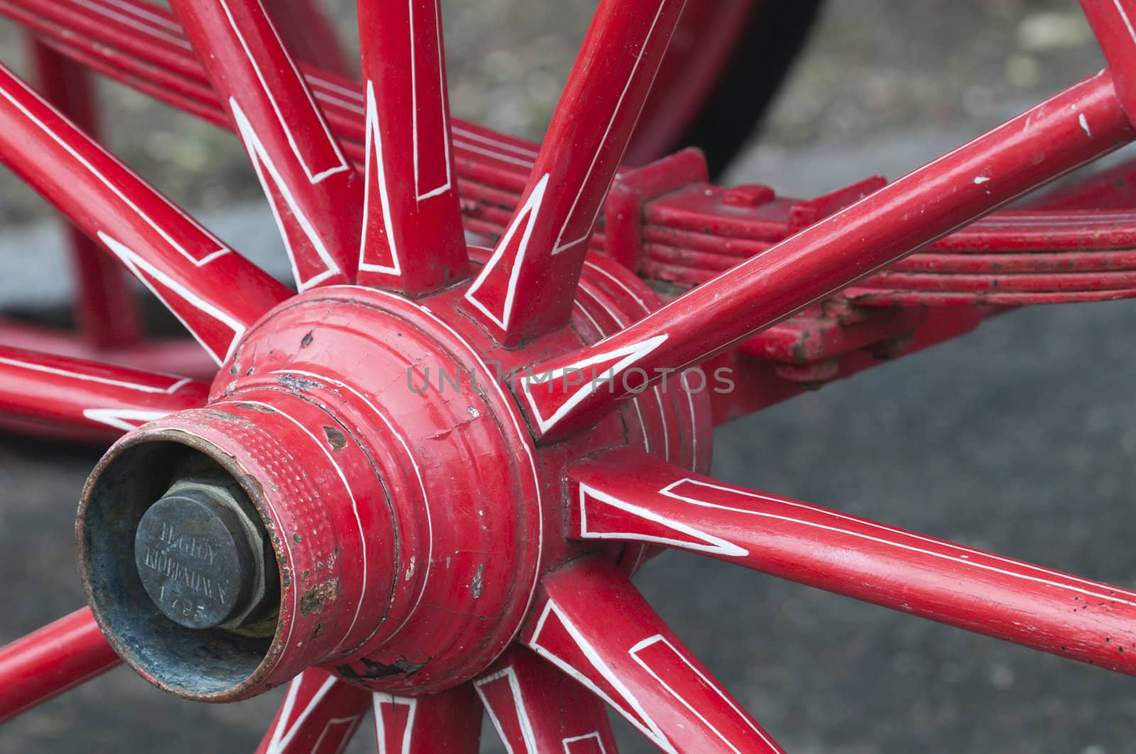 Anicent red wheel in a horse driven wagon