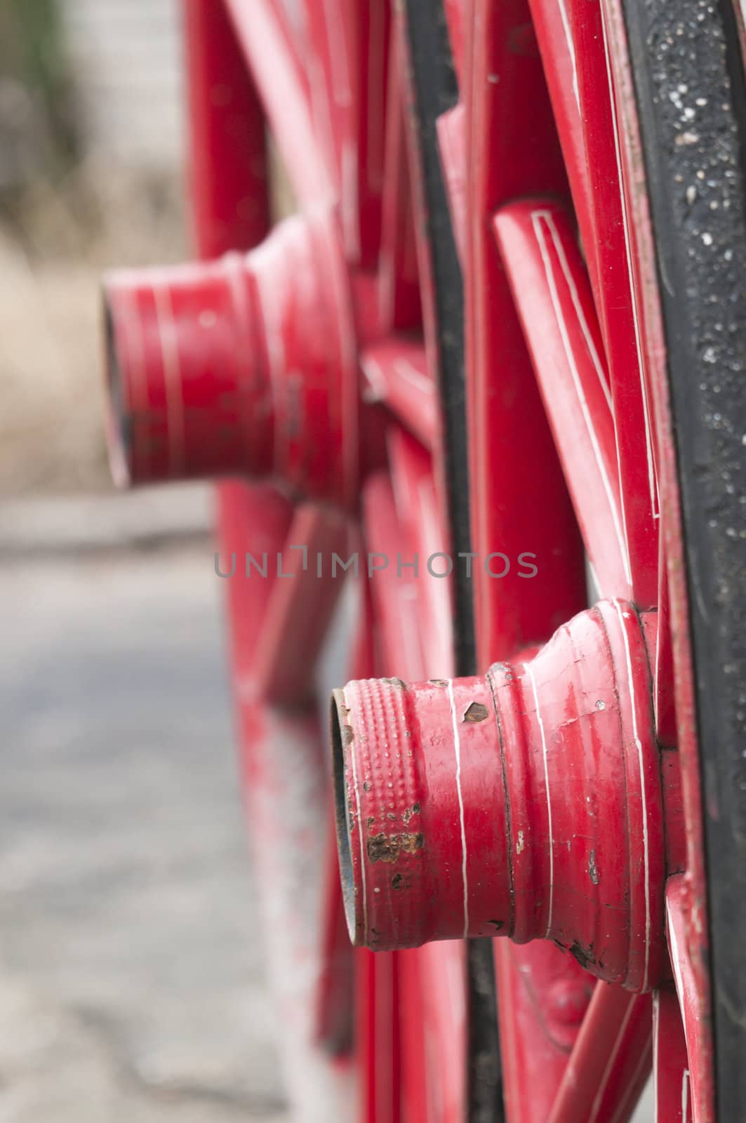Anicent red wheel in a horse driven wagon