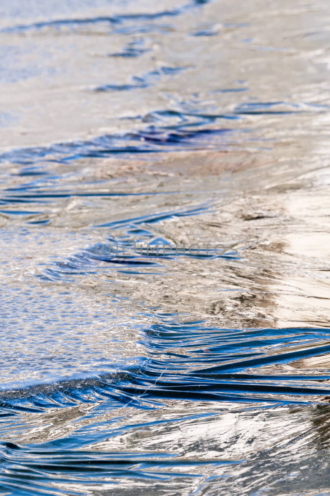 Ice formations on a pond surface in winter