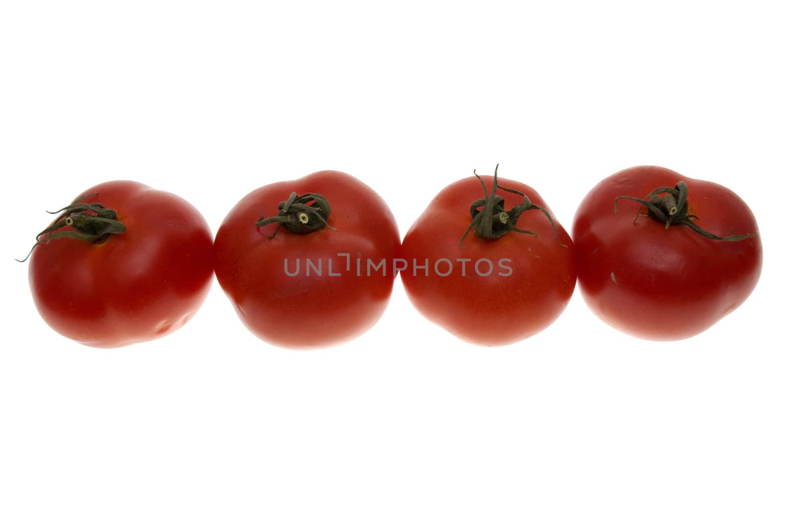 Four red tomatoes isolated on white background.
