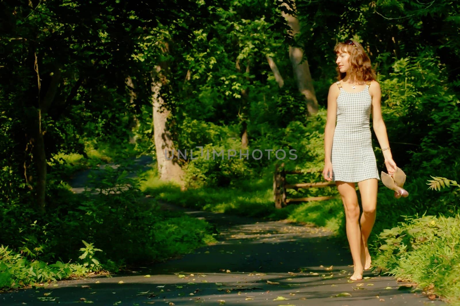 Pretty girl on forest path by cardmaverick