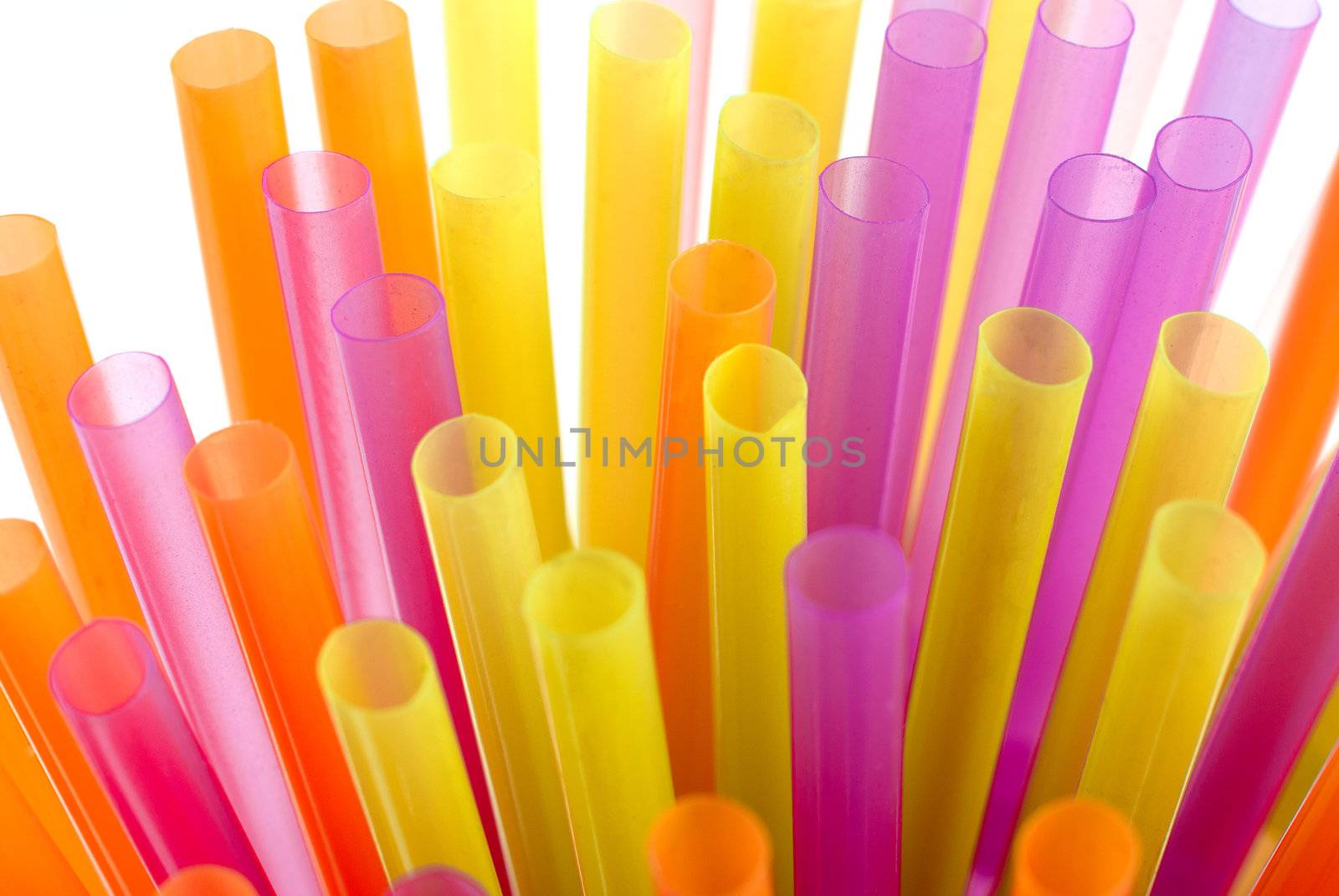 Color vivid drinking straws background on white background.