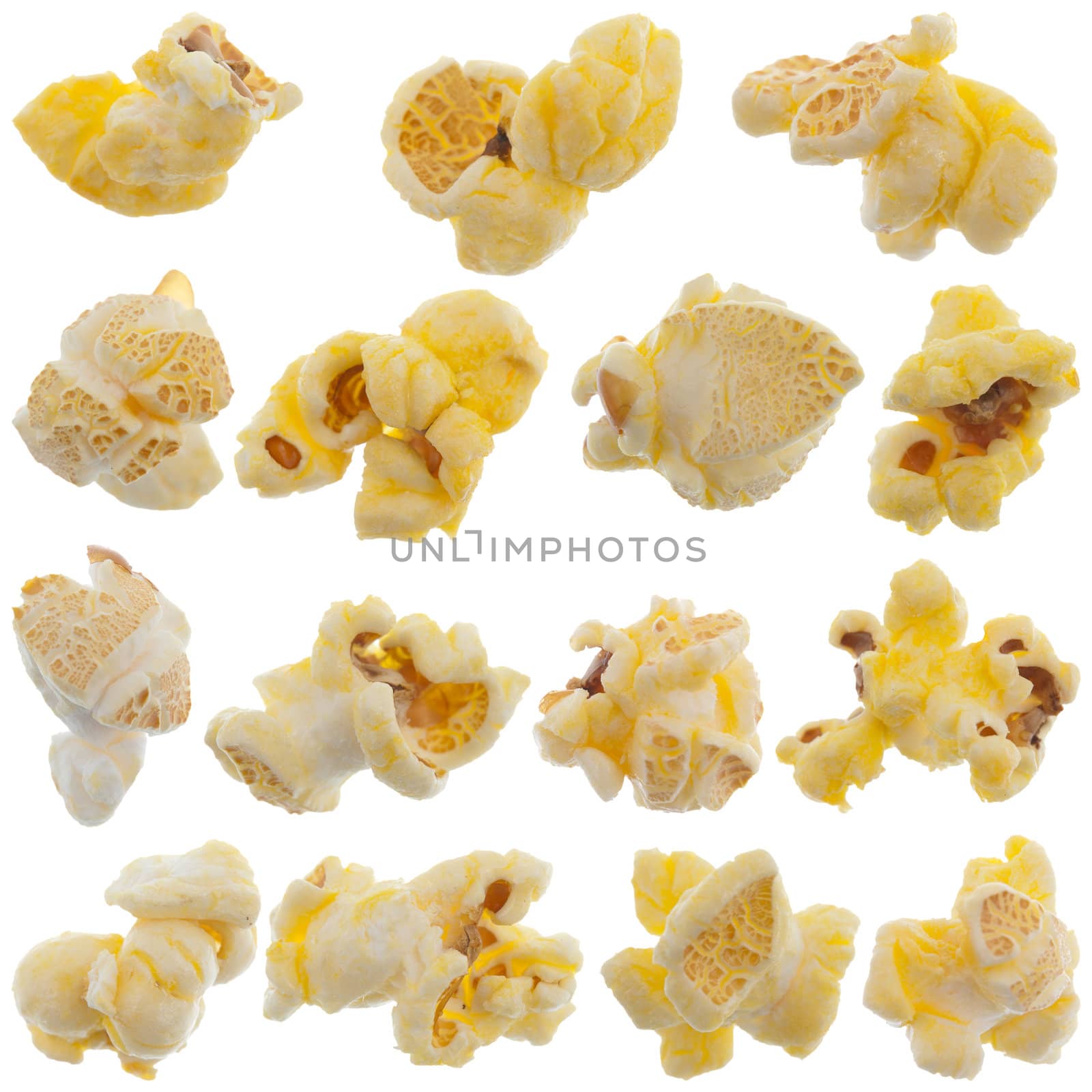 Popped kernels of pop corn snack isolated on white background.