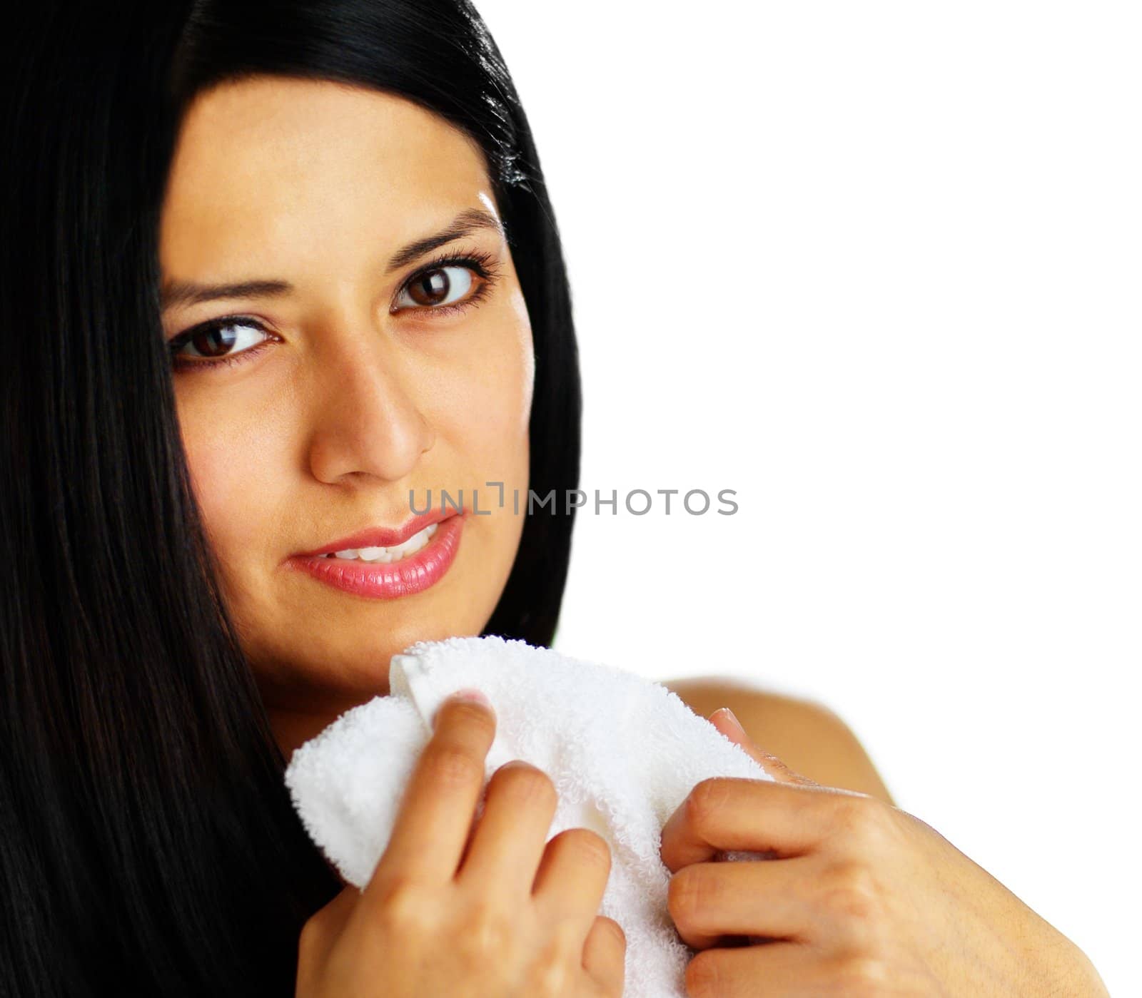 Close up of a spa woman hugging a white towel.