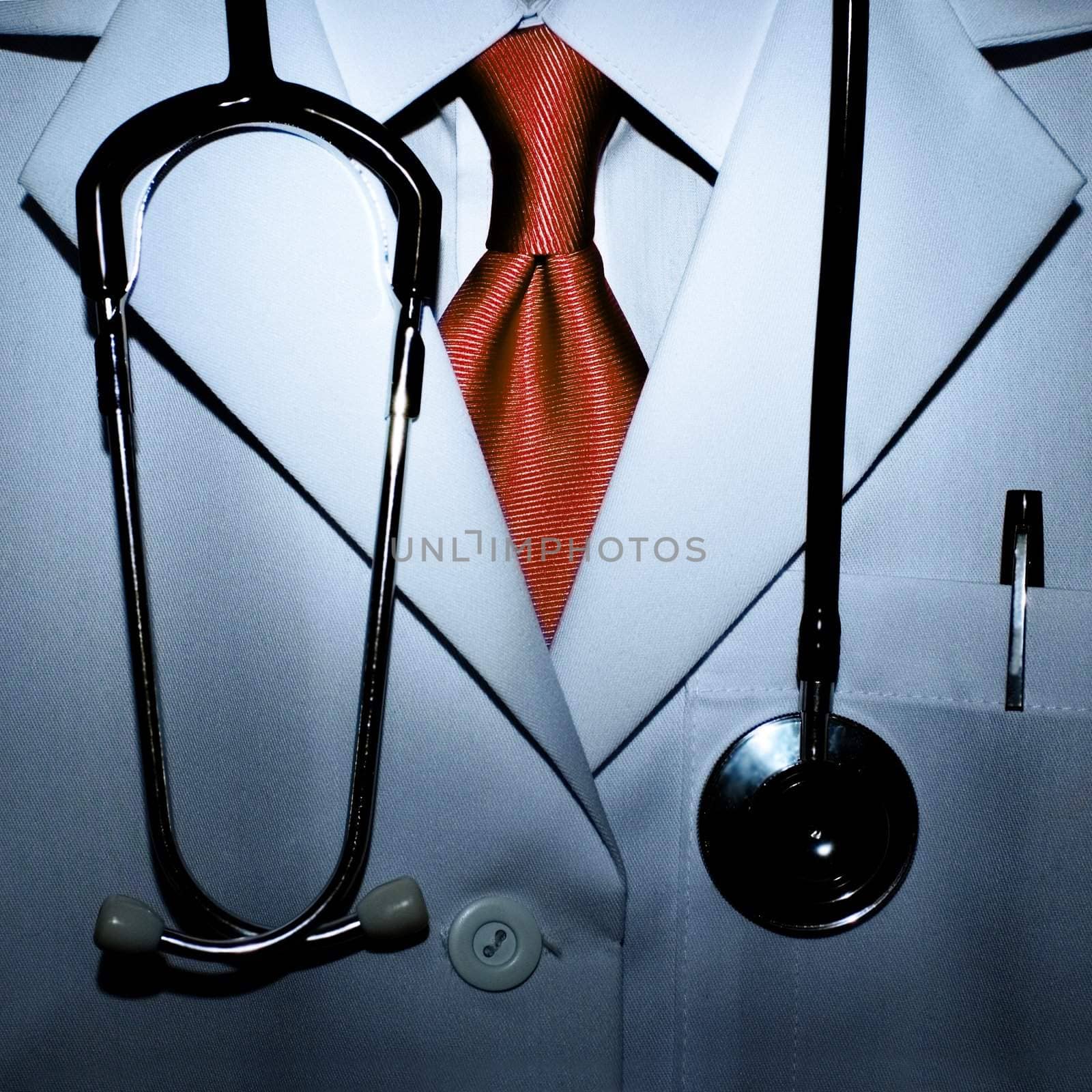 Conceptual photo of a scarry doctor with blood red tie.