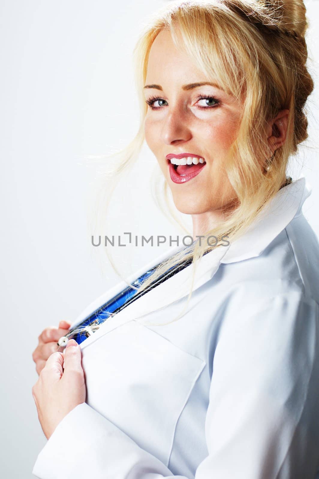 Happy smiling healthcare professional against a white background.