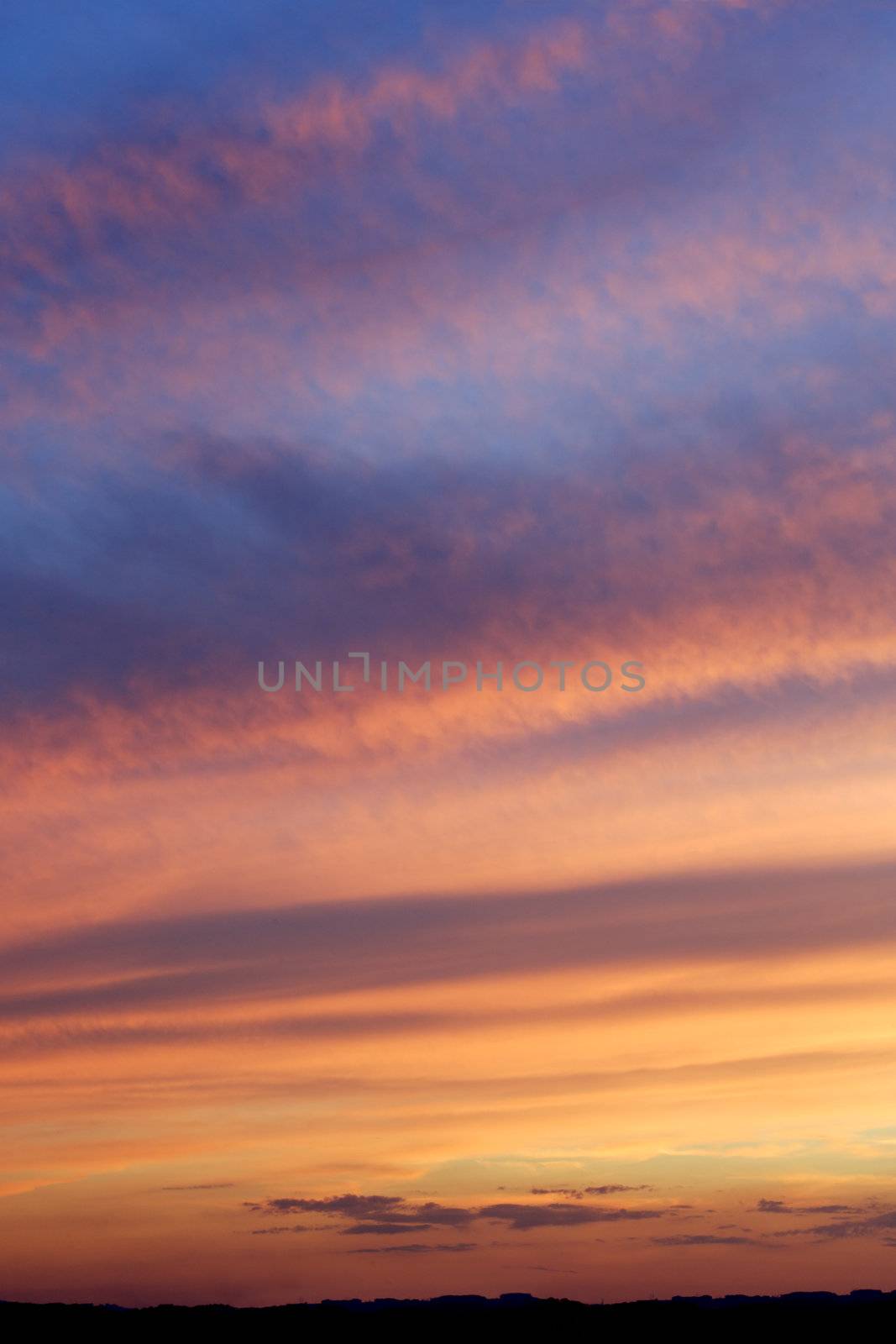 Photo of a beautiful dramatic sky as the sun disappears below the horizon.