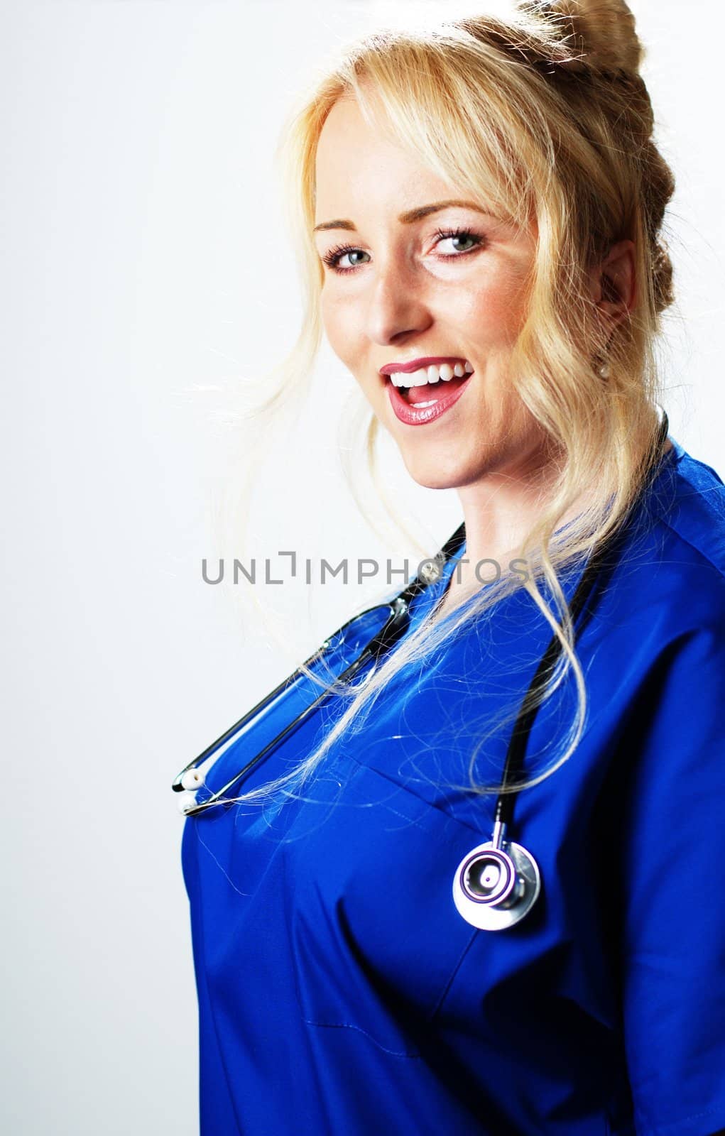 Happy smiling healthcare professional against a white background.