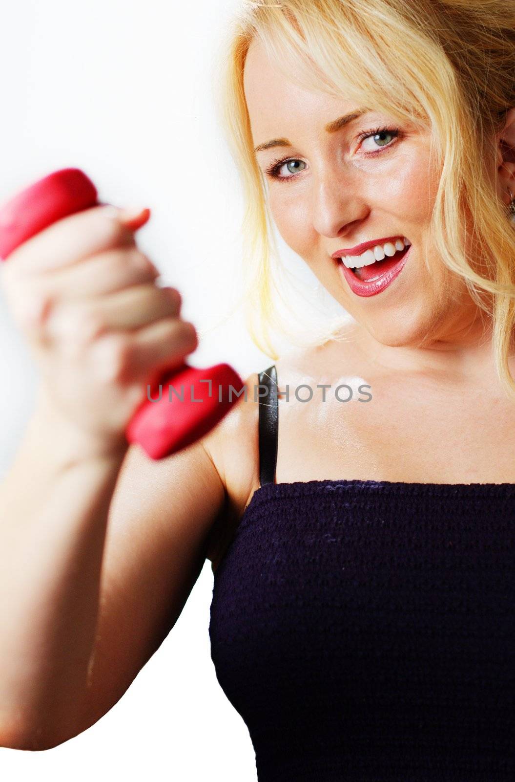 Attractive young woman excercising against a white background.