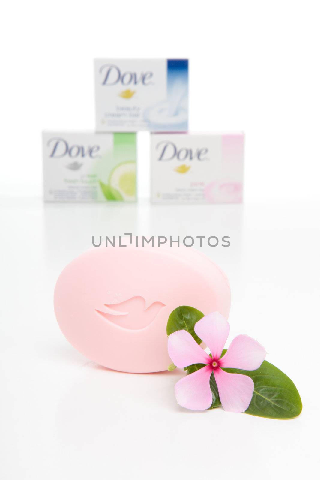 A selection of Dove cream beauty soap bars with a pink soap in the foreground.  White background.  Editorial use only.