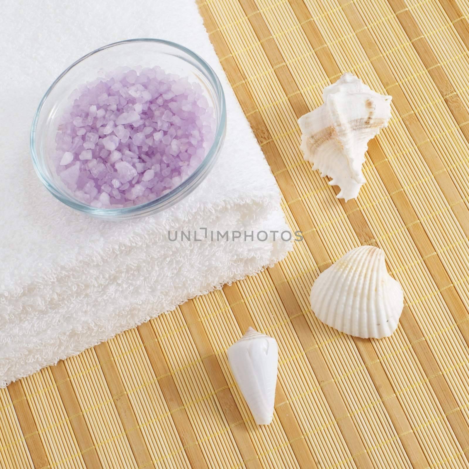 Bath products being displayed on a bamboo mat.