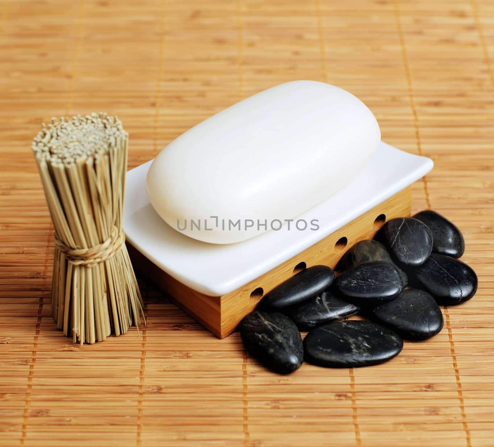 Decorative soap display on bamboo reed mat.