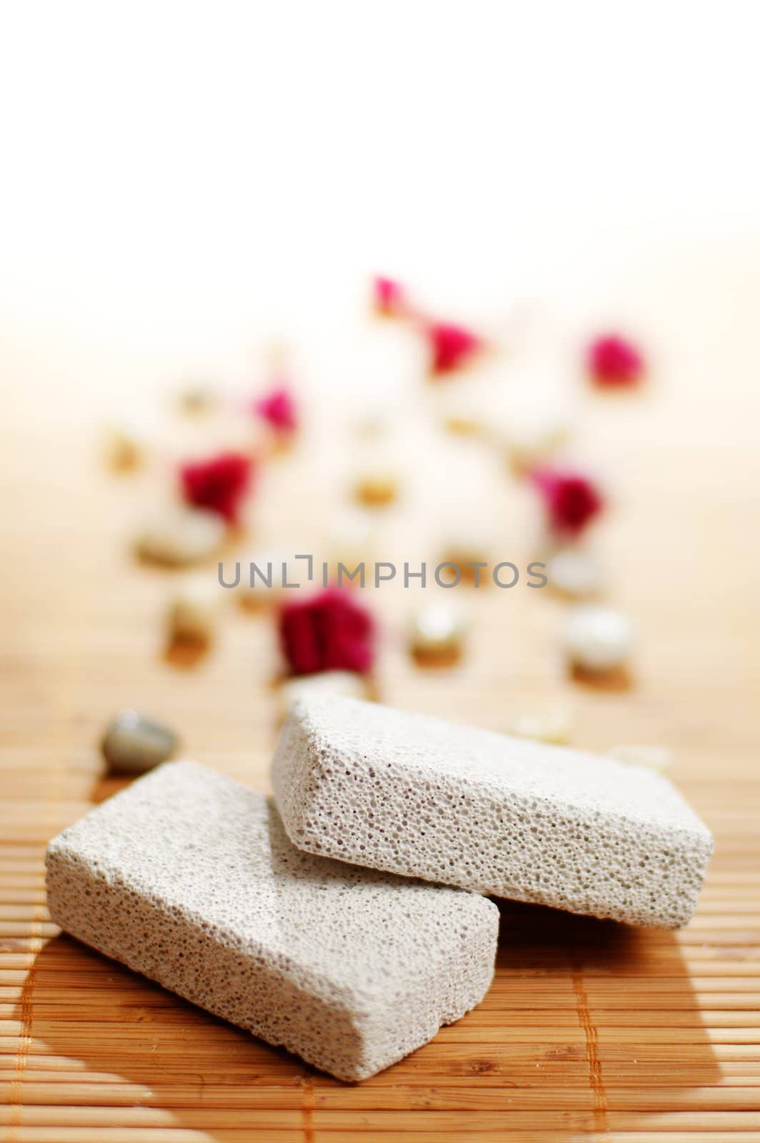 Pumice stones on top of a bamboo mat.