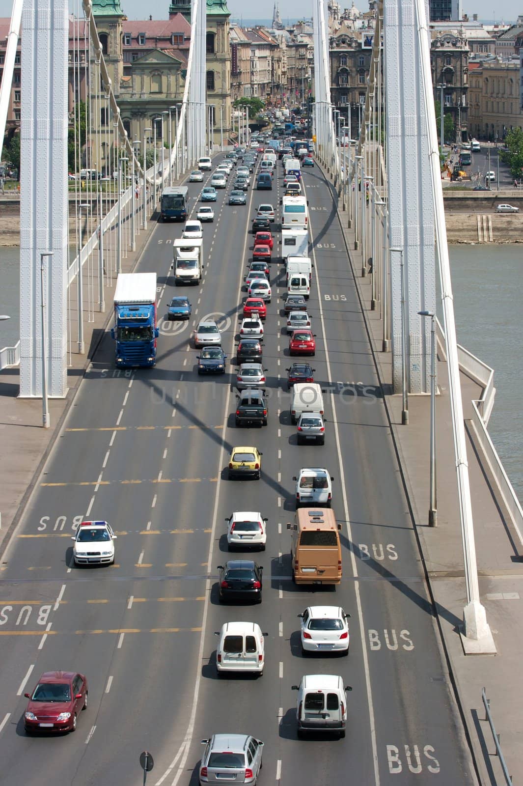 Heavy traffic going through a bridge