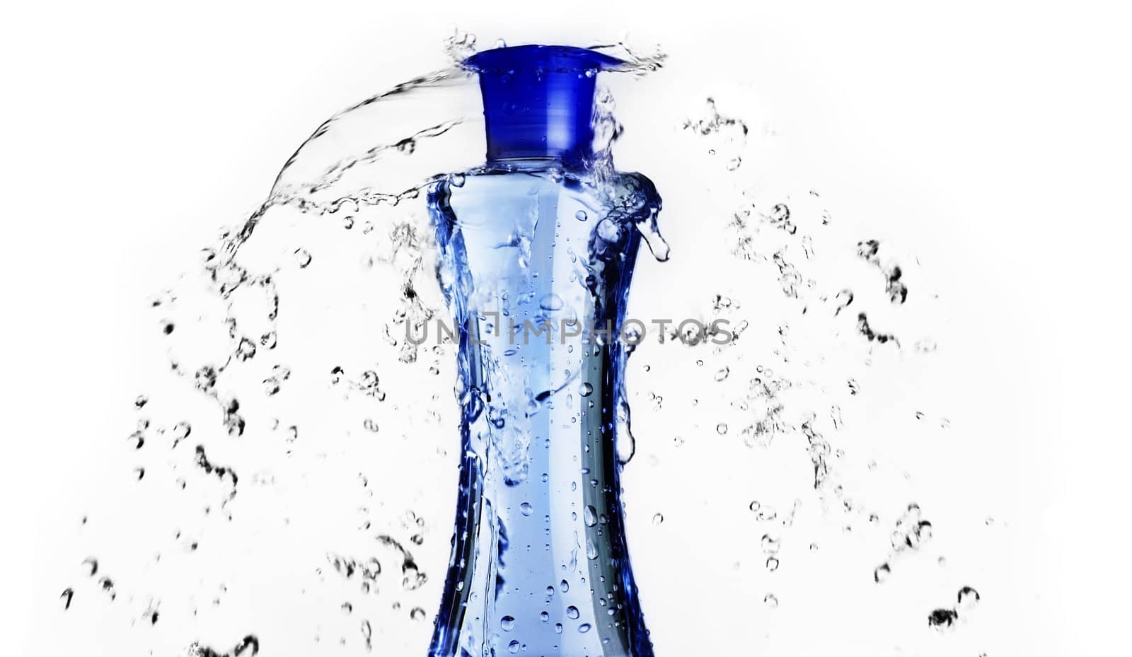Blue bottle with water splashing around it.