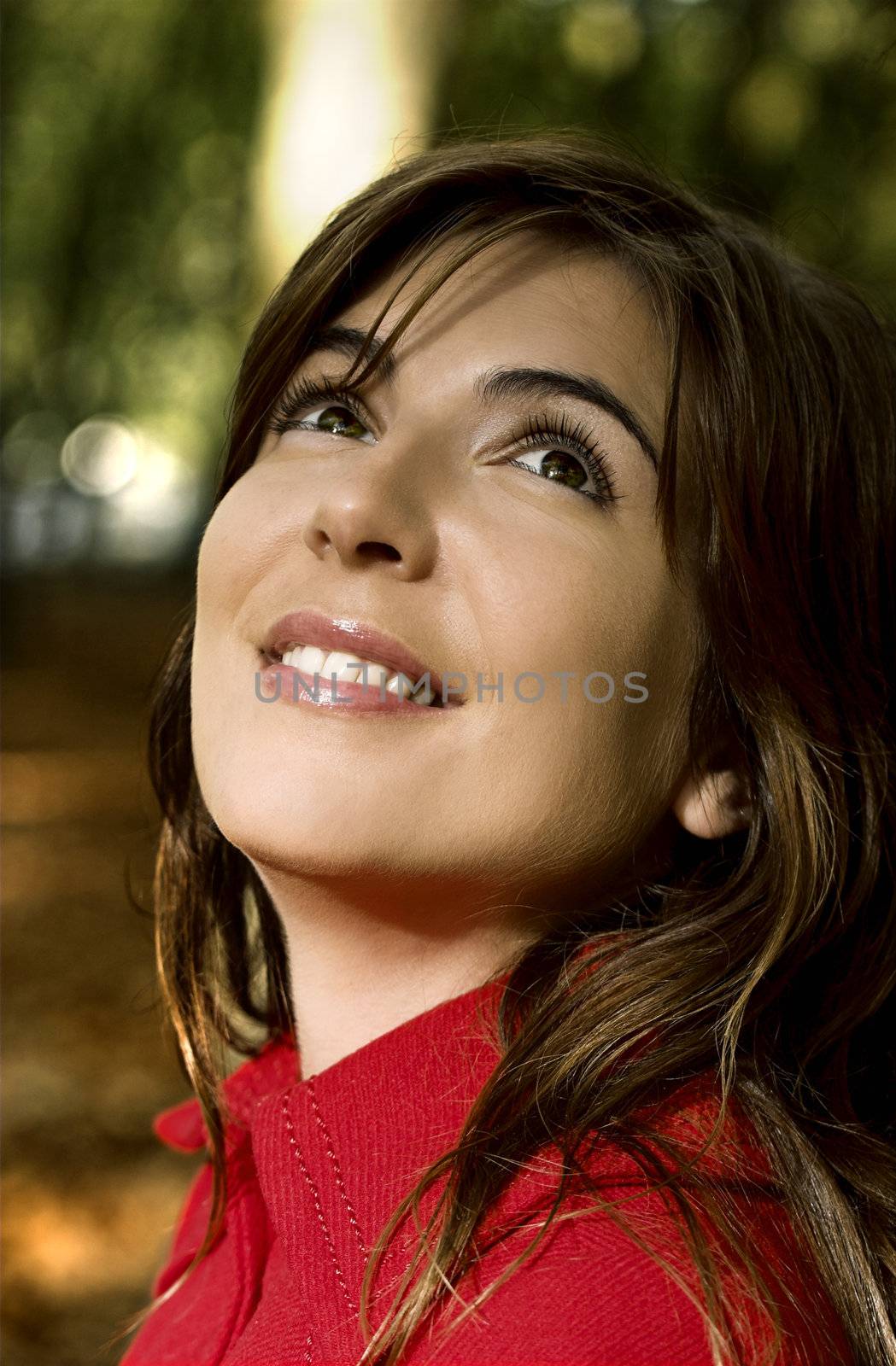 Closeup portrait of a beautiful happy woman in blur background