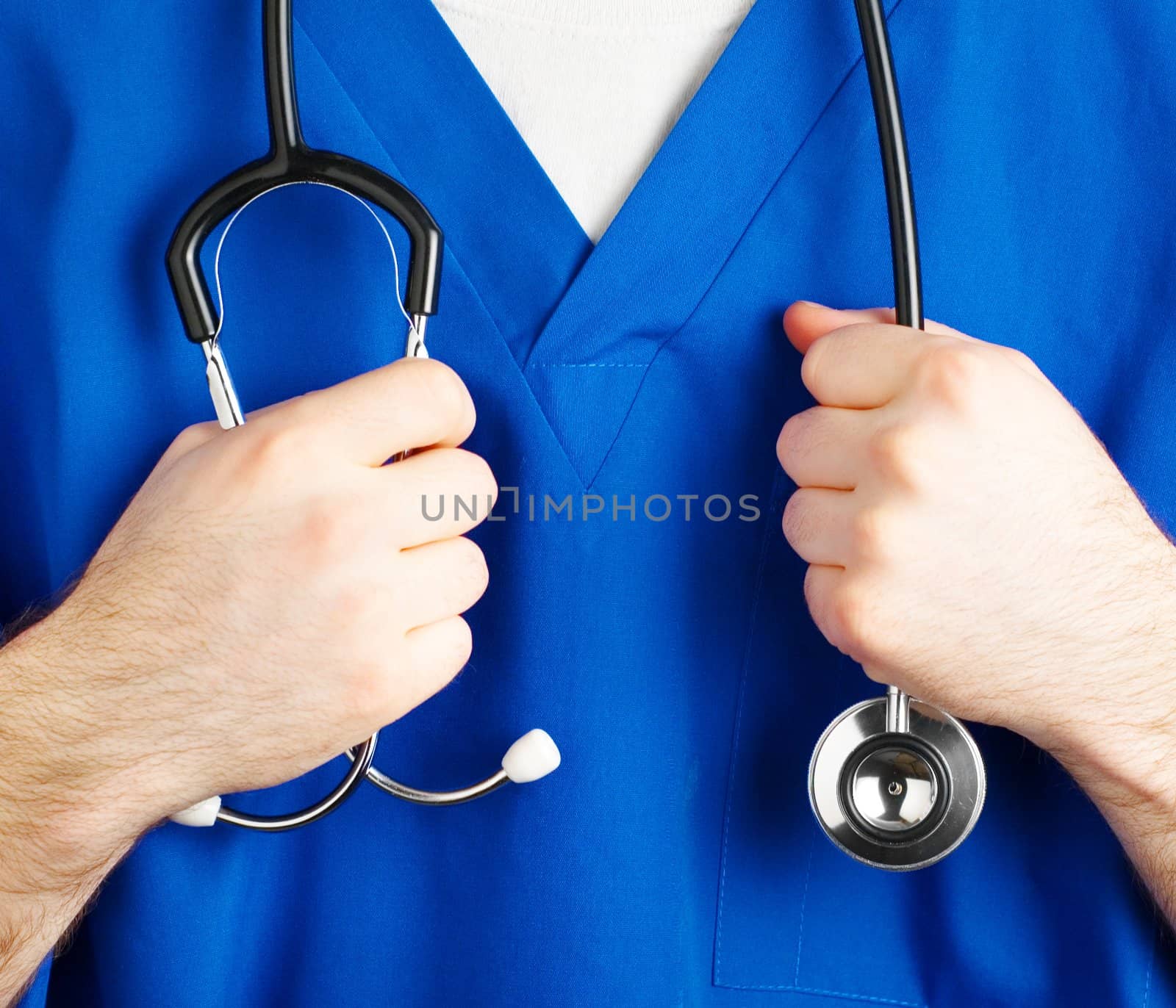 Close up of blue scrubs and equipment.