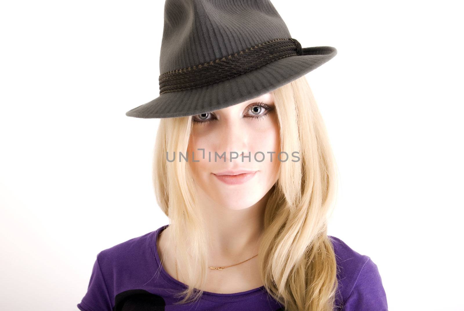 Portrait of a young seductive blonde in hat