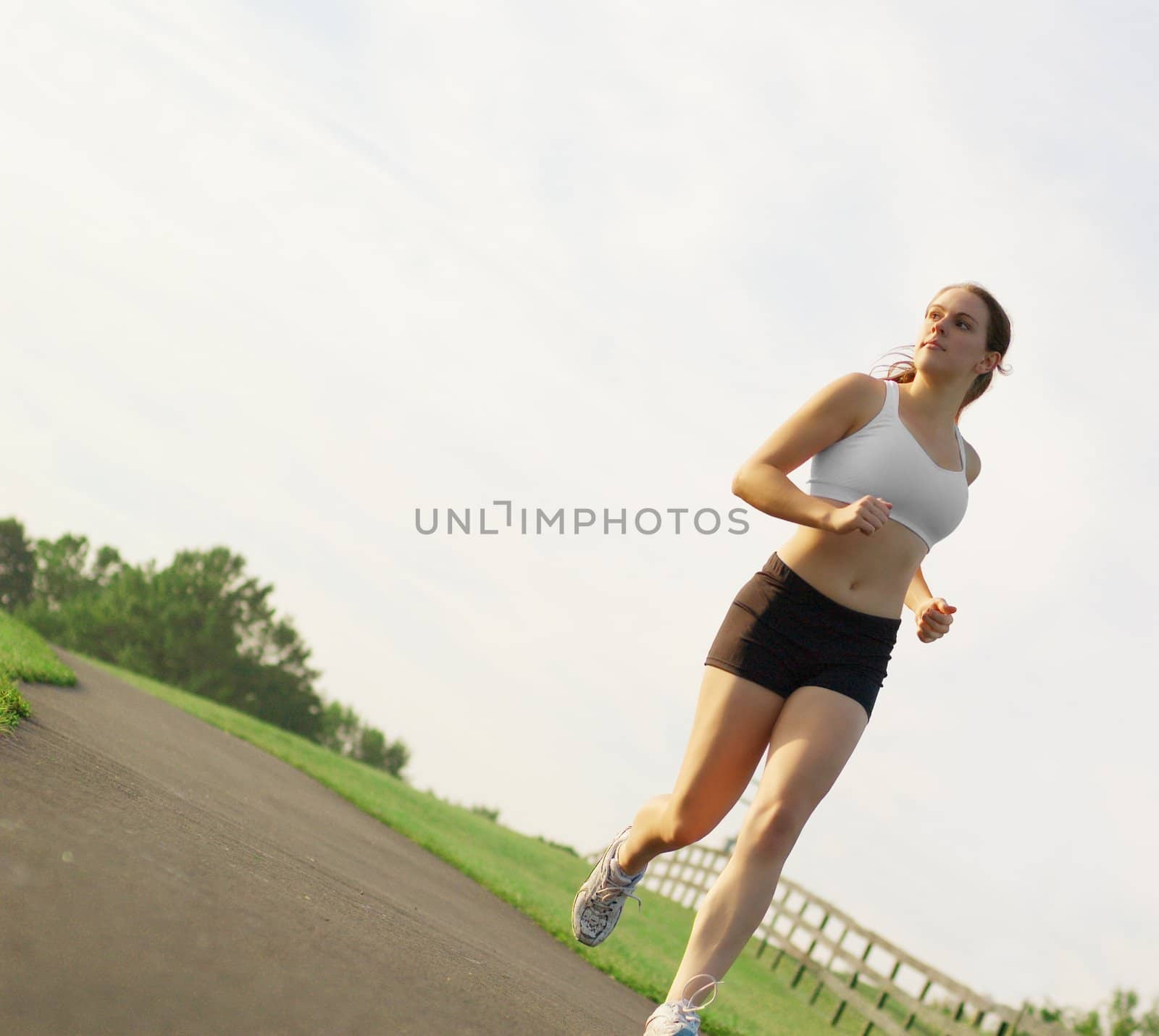 Beautiful young woman runner having a workout session.