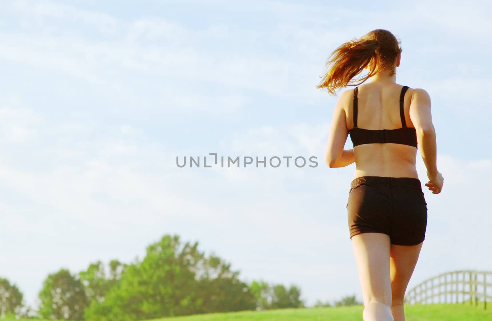 Beautiful young woman runner having a workout session.