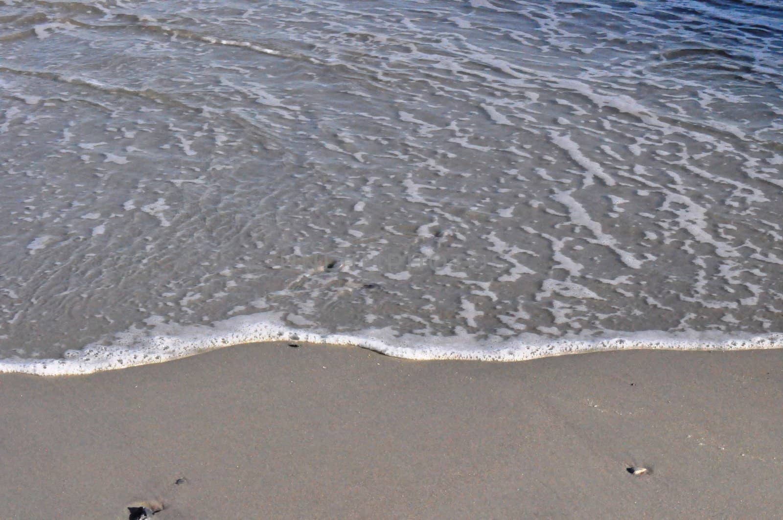 Sand and waves by RefocusPhoto