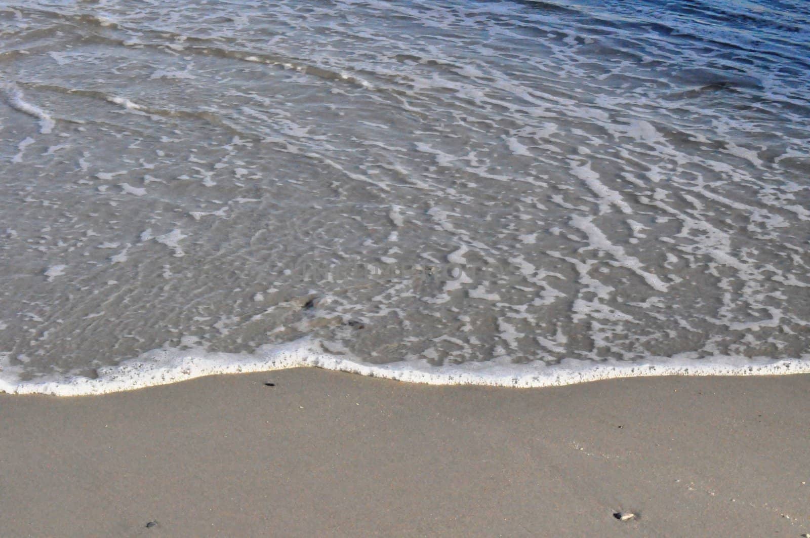 Sand and waves by RefocusPhoto