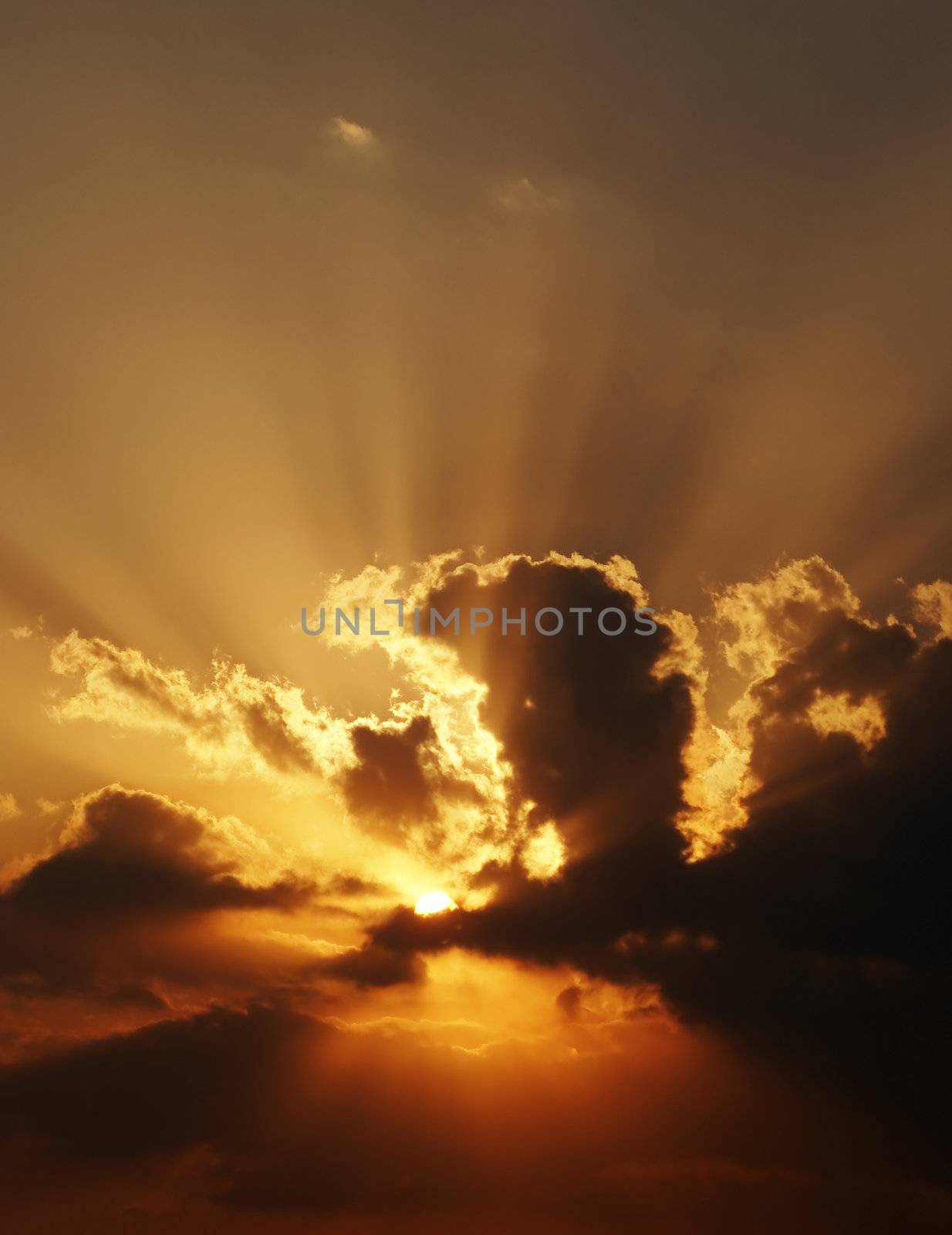 dramatic sundown scene with dark clouds and rays. Good as background, wallpaper.