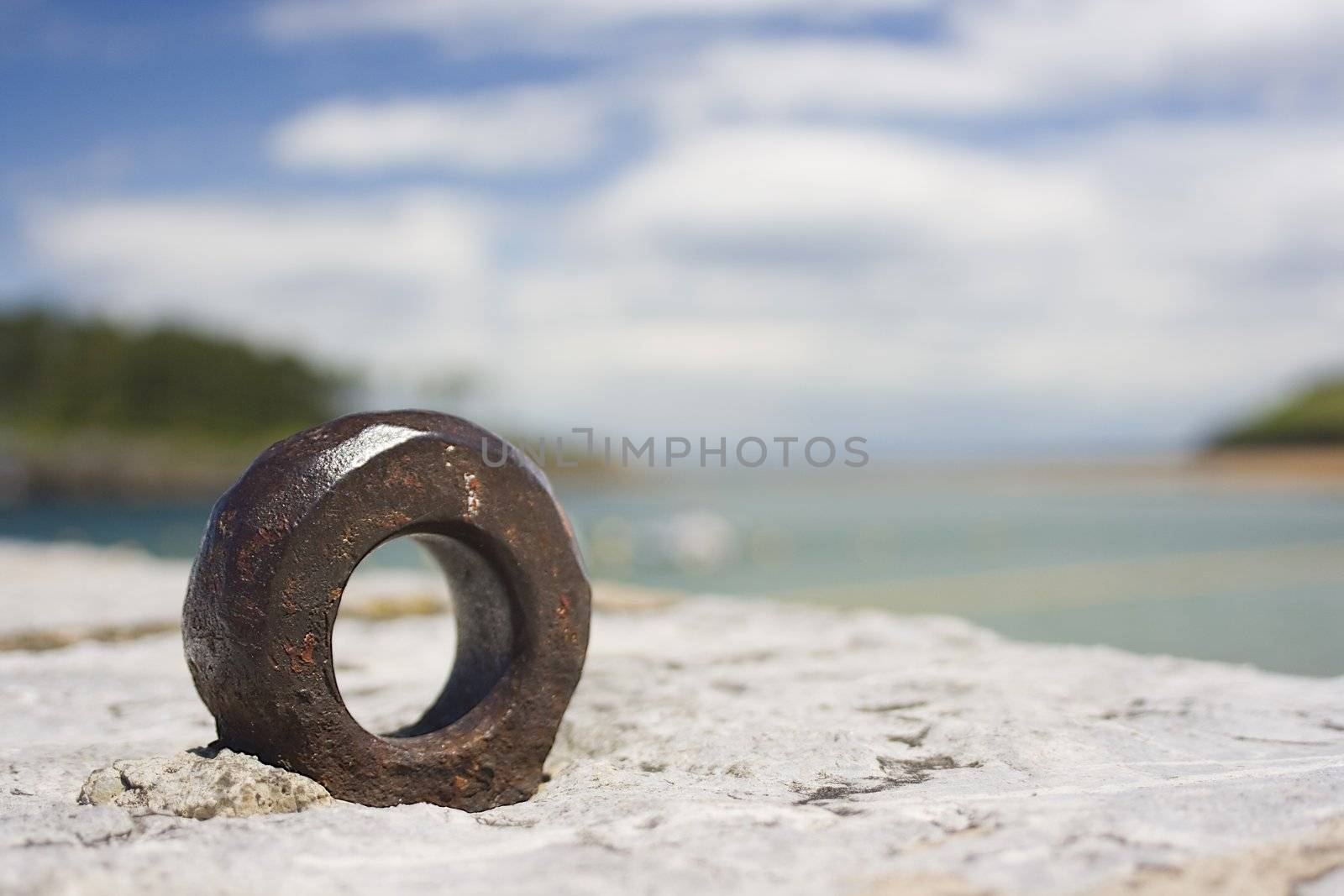 image of a metal rusted ring in a landscape