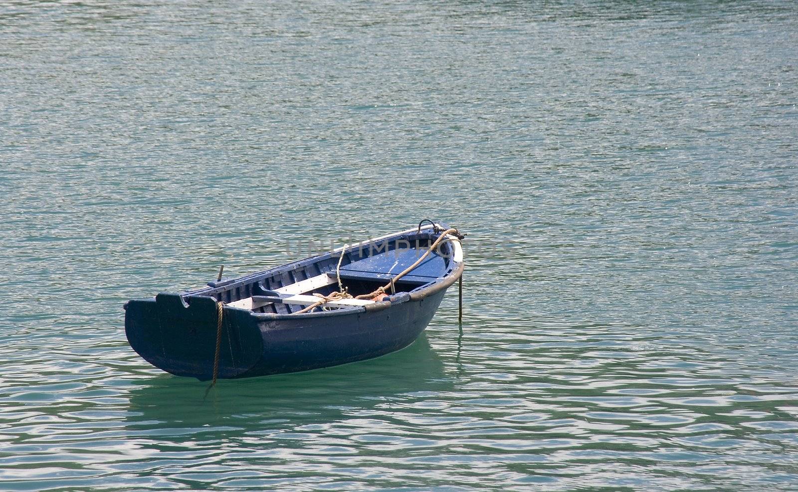 image of a lonely boay in the calm sea