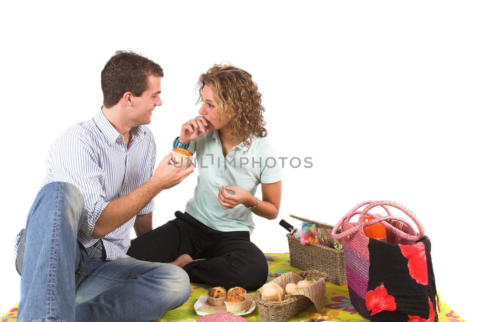 Lovely young couple having a picnic