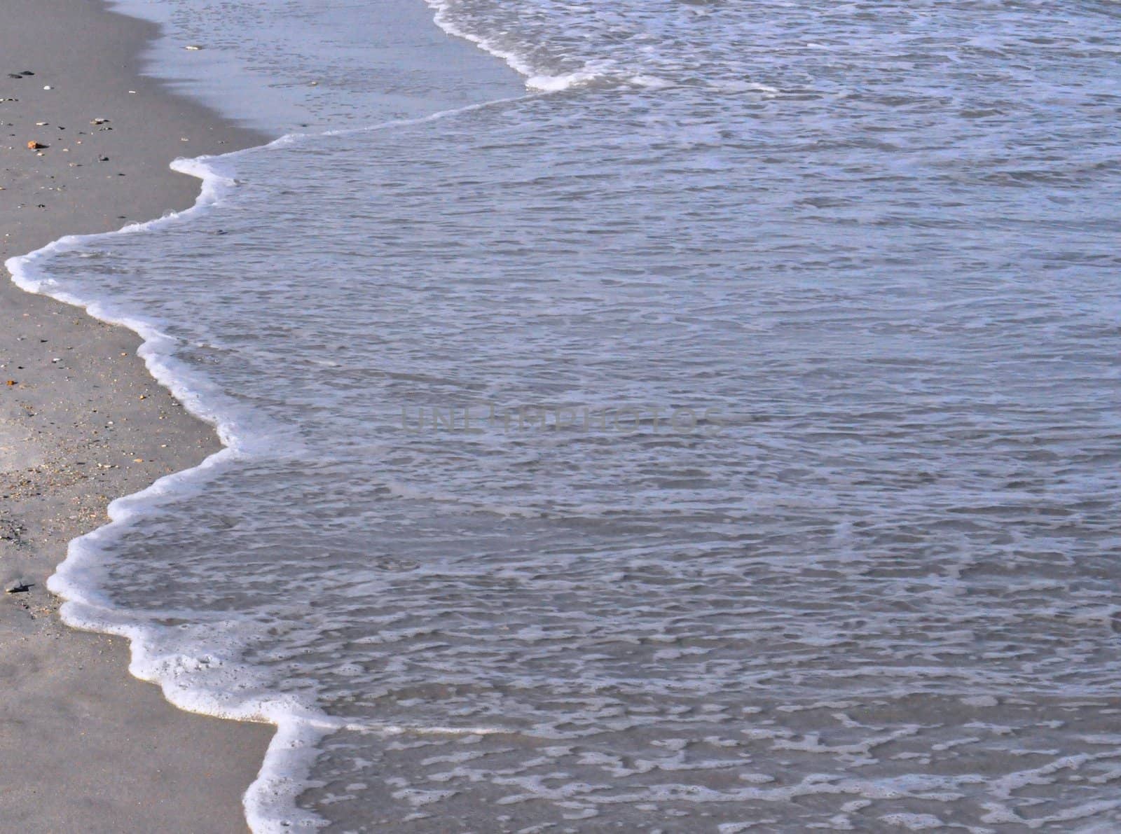 Sand and waves by RefocusPhoto