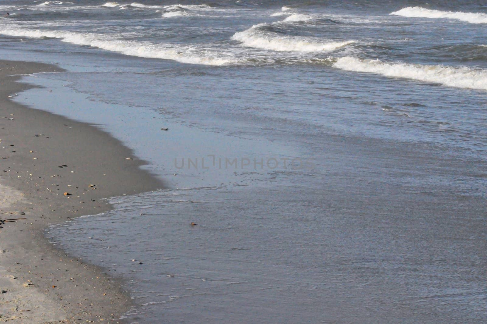 Sand and waves by RefocusPhoto