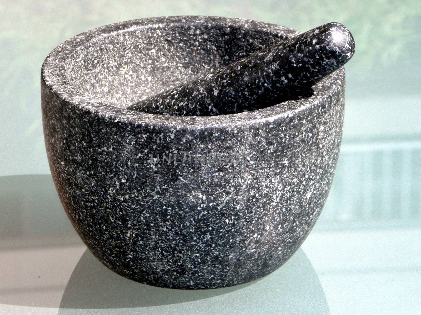 A mortar with pestle by bozbud