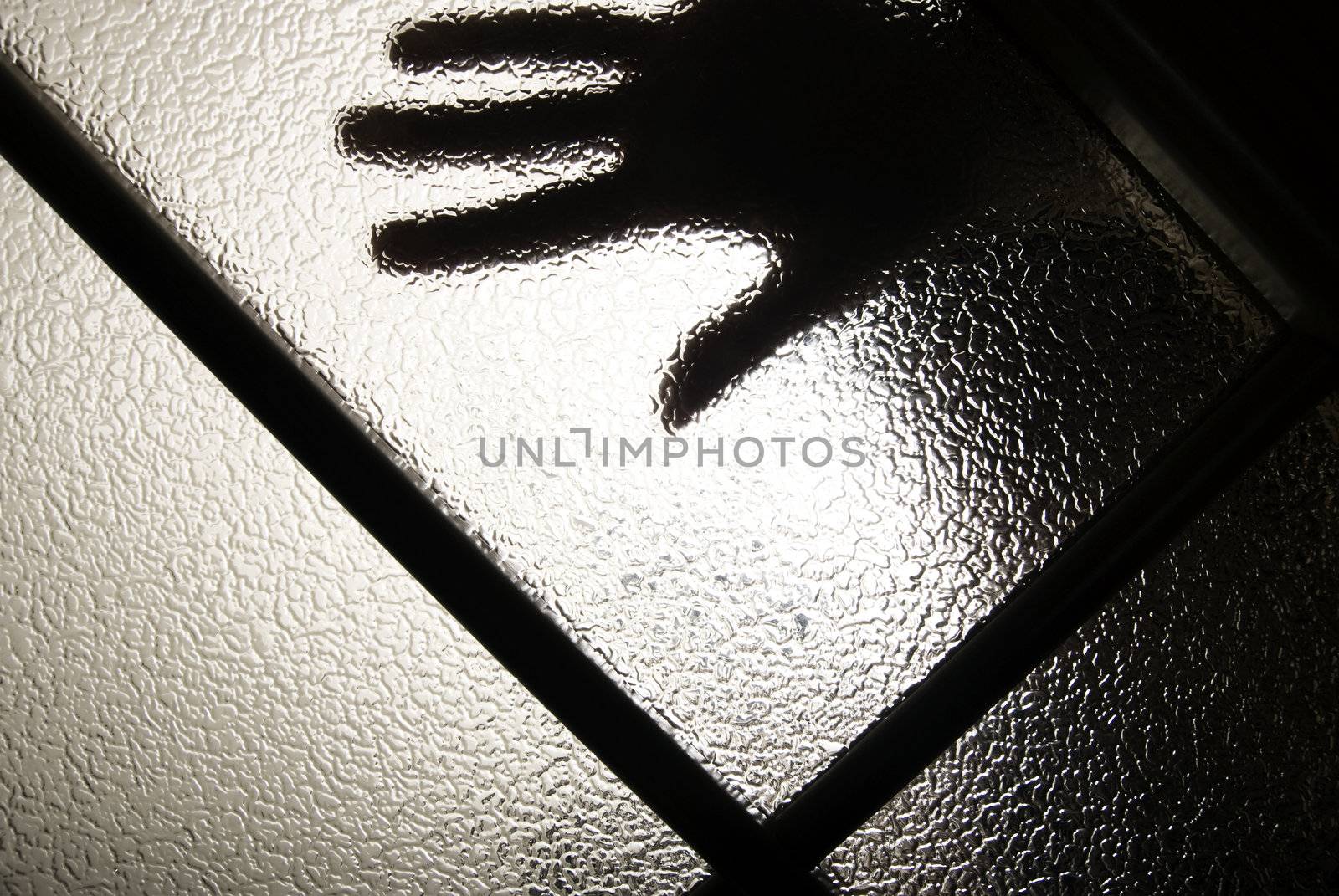 hand behind the glass as a concept of hopelessness and depression 