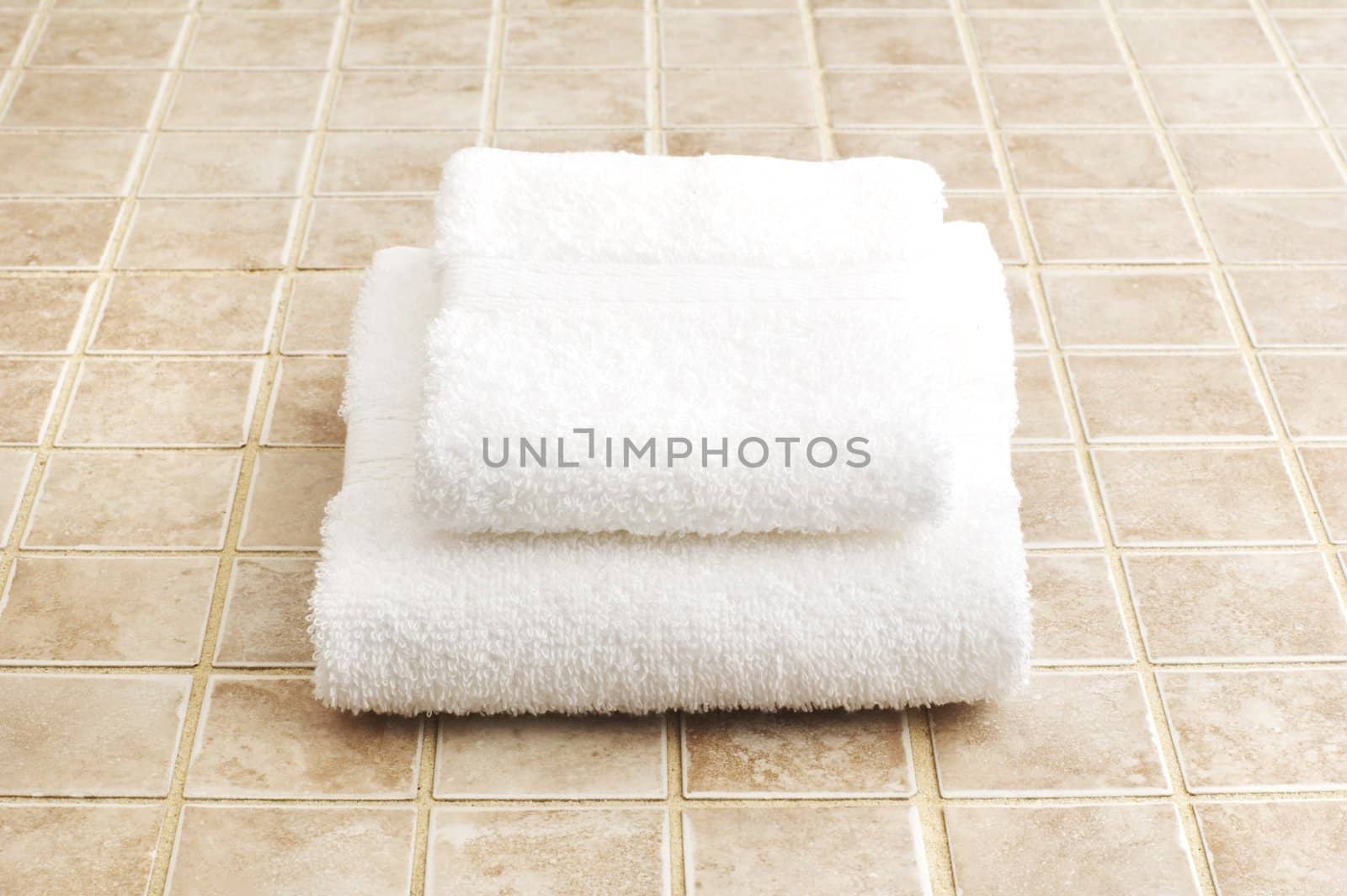 Bathroom object photographed against a stone tile backdrop.