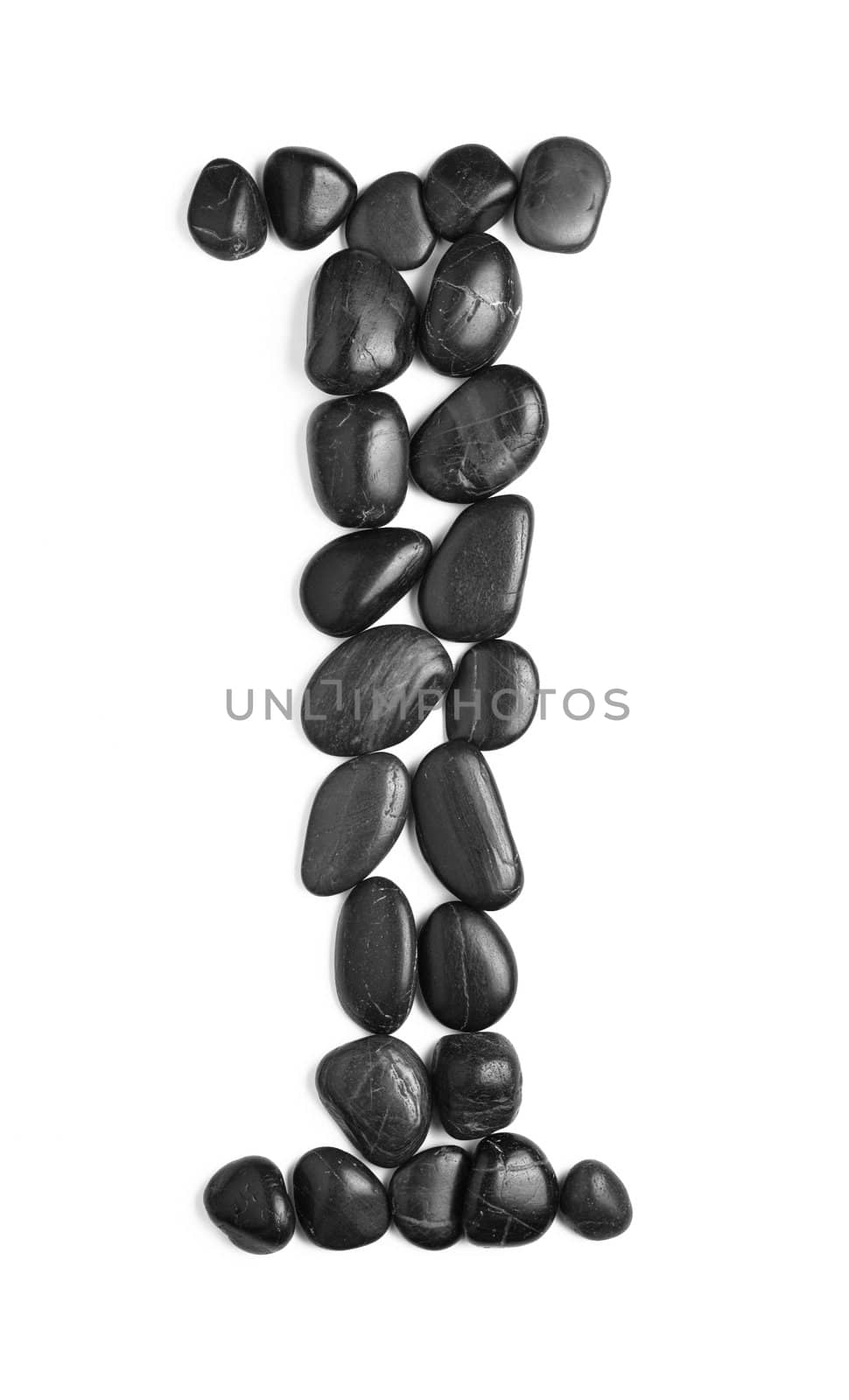 Black rock letter photographed against a white background.