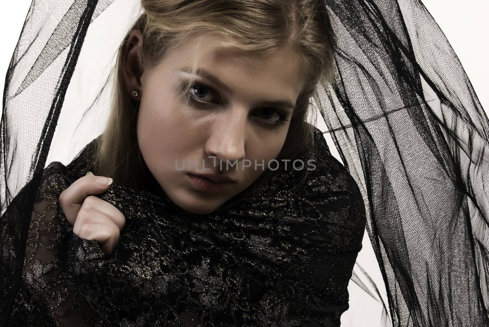 Beautiful young bride in black isolated on white