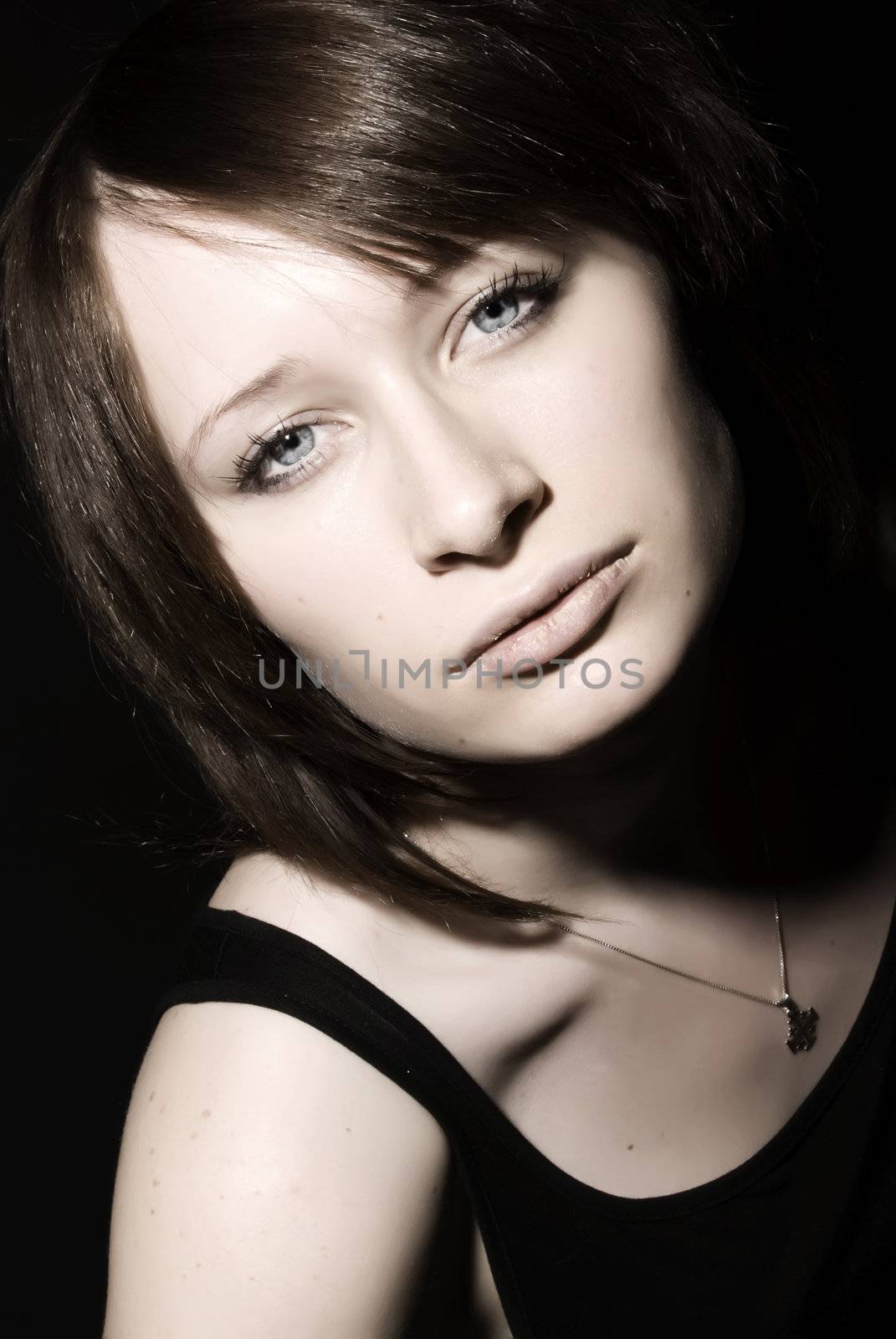 Portrait of a young beautiful brunette close-up