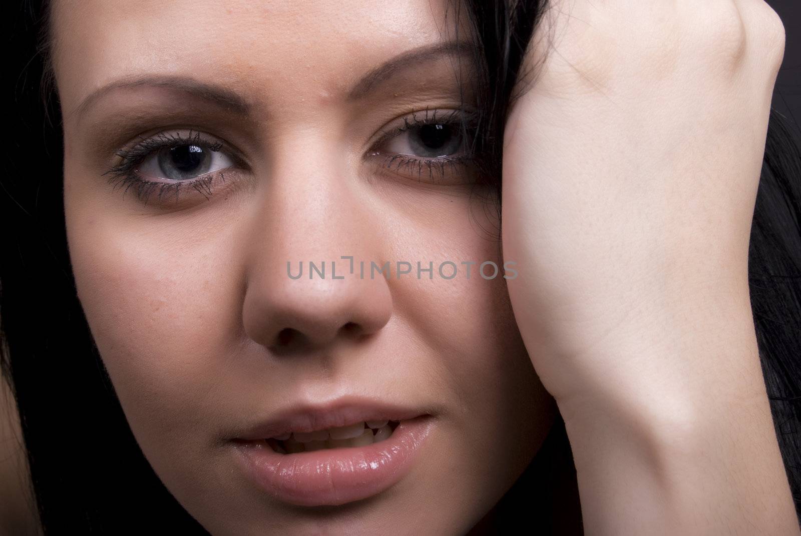 Portrait of a young beautiful brunette close-up