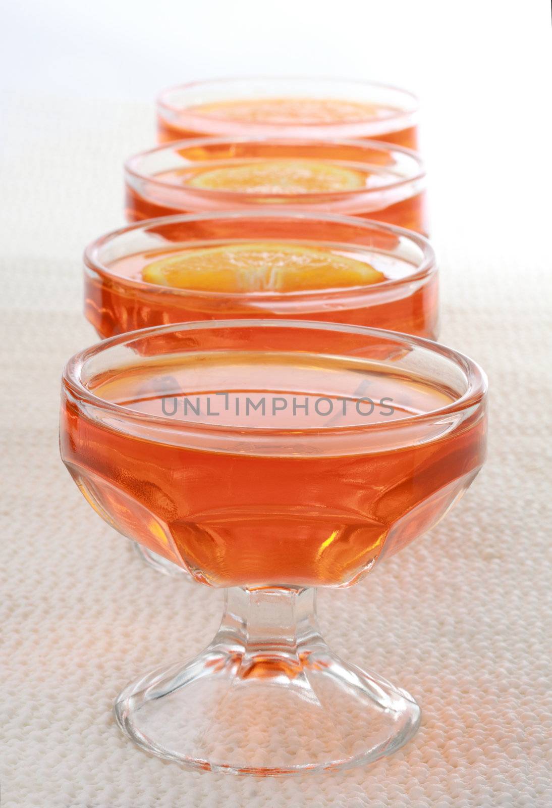 orange jelly dessert in a nice glass bowl