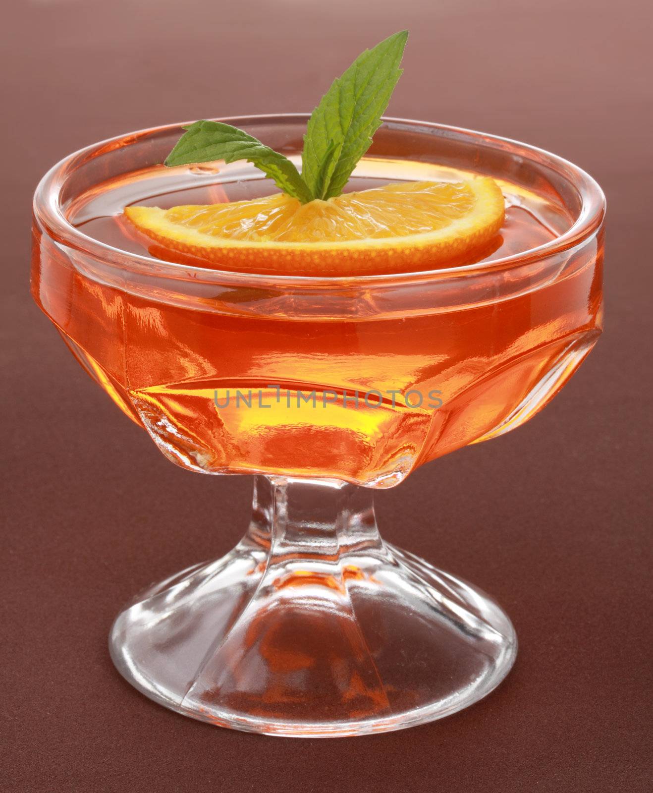 orange jelly dessert in a nice glass bowl