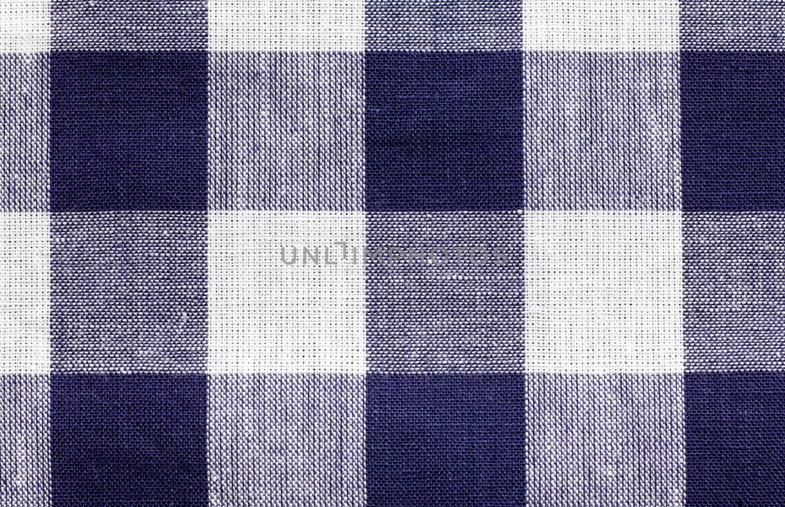 some blue and white checkered fabric forming a background pattern