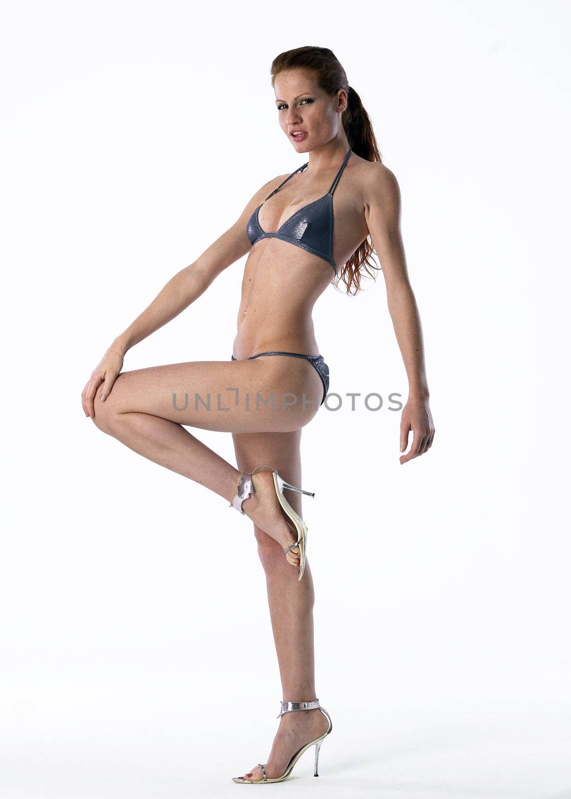 Pretty model wearing bikini on white isolated background