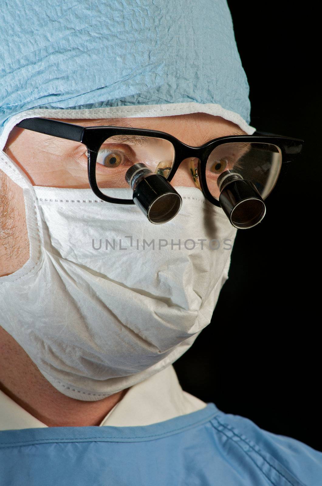 doctor in mask and glasses ready for surgery