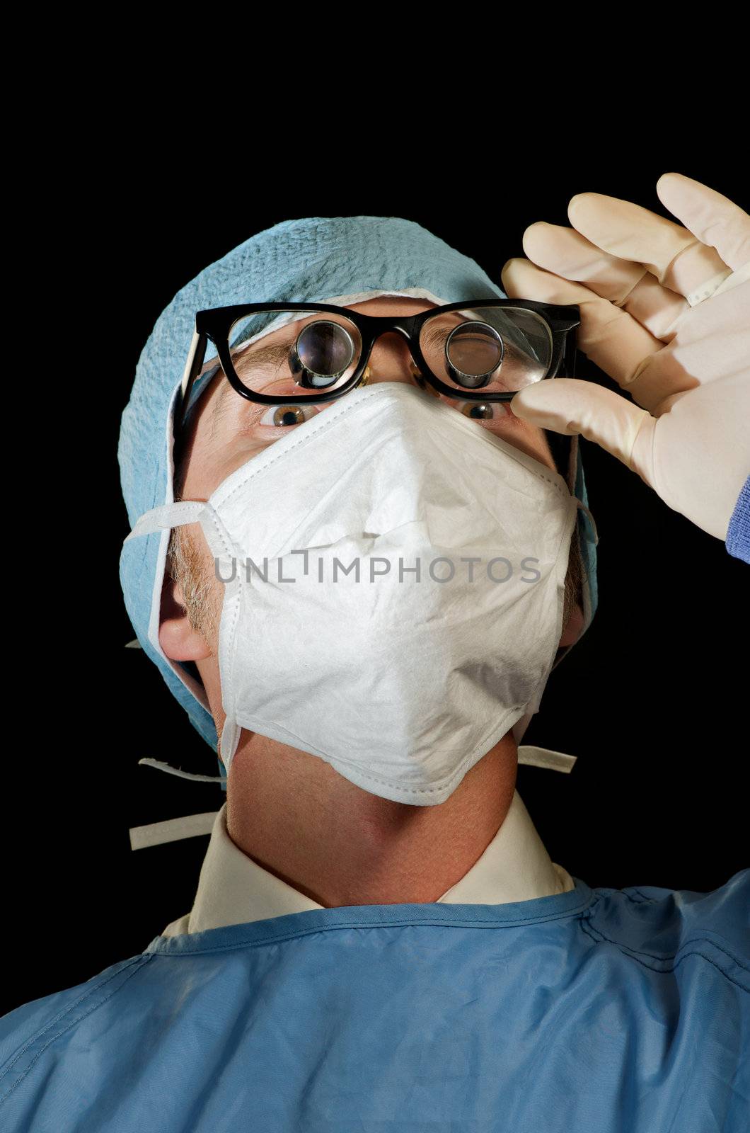 Surgeon looks down at patient